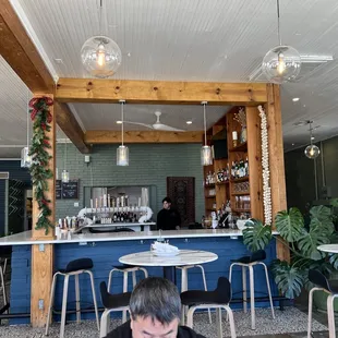a man sitting at a table in a restaurant