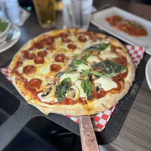 Half pepperoni, half margarita with mushrooms