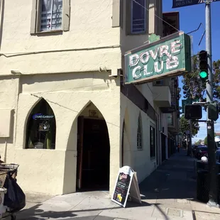a woman on a scooter in front of a building