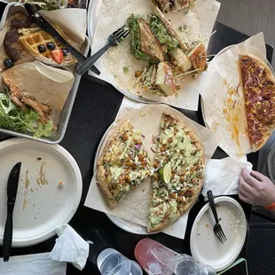 Sampler platter of three sandwiches and two pizzas