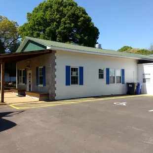 a white building with blue shutters