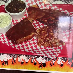 a plate of ribs and sides