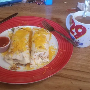 a plate of burritos and a cup of coffee
