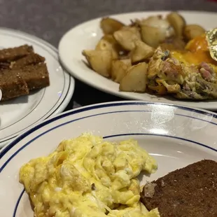 two plates of breakfast food