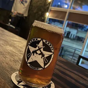 a pint of beer on a table