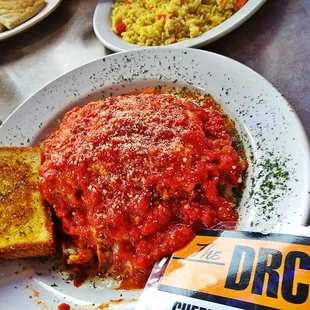 a plate of spaghetti and bread