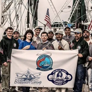 a group of people holding a banner