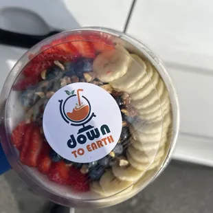 a cup of fruit and yogurt