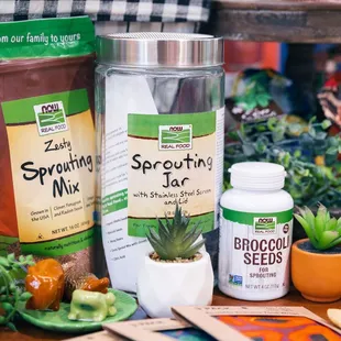 sprouting mix, a jar of broccoli seeds, a container of