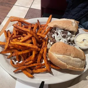 Philly Cheesesteak?  Heather is becoming an expert at this sandwich and those sweet potato fries are so crispy and delicious.
