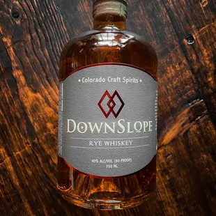a bottle of down slope rye whiskey