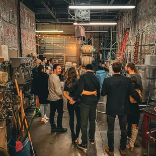 a group of people in a brewery