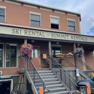 the entrance to the ski rental rental building
