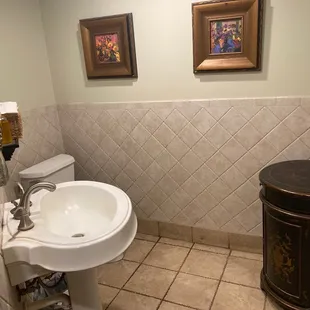 a bathroom with a sink and toilet