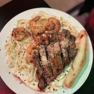 Steak and shrimp on fettuccine Alfredo