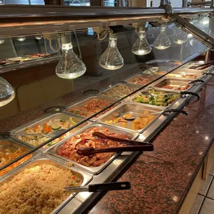a buffet full of different types of food