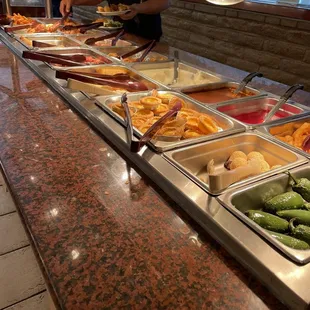 a buffet with a variety of food items
