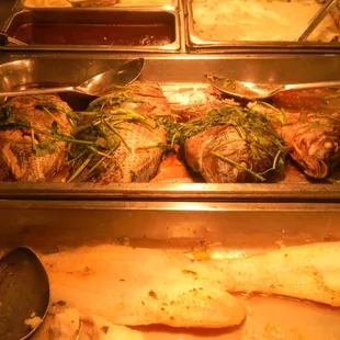 a variety of food items in a buffet