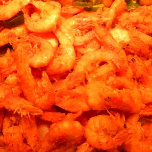 a tray of shrimp and vegetables