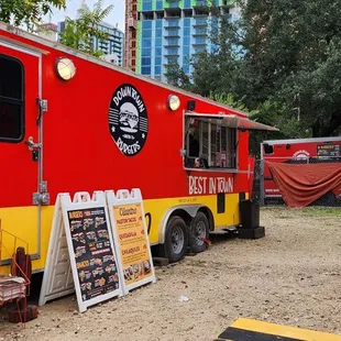a red and yellow food truck