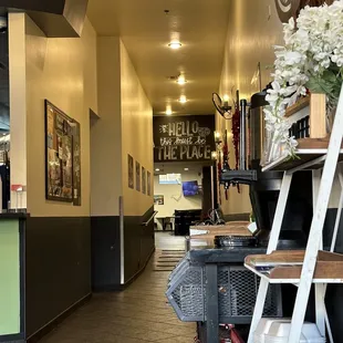 Hallway from front of cafe toward seating in back