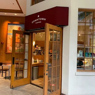 the entrance to a coffee shop