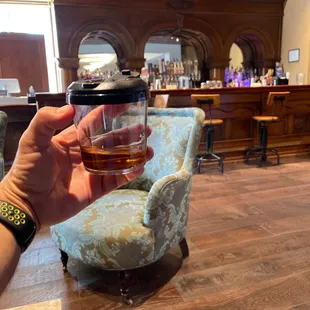 Looks like weather.  Popped in this antique theater. Awesome. Bonus. TX whiskey double neat in a adult sippy cup. Yee haw brah