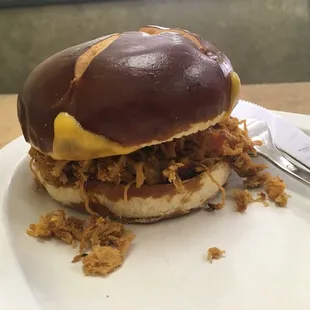 Pulled pork on a pretzel bun