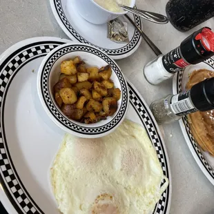 3 eggs over easy, home-fries and sweet Grits