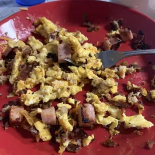a plate of scrambled eggs and sausage