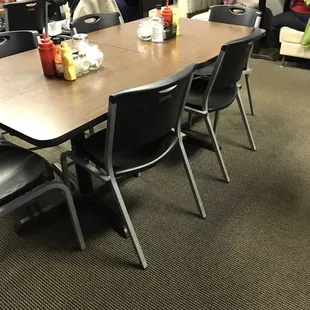 a large dining room with tables and chairs