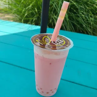Dragon fruit bubble tea with passionfruit bubbles