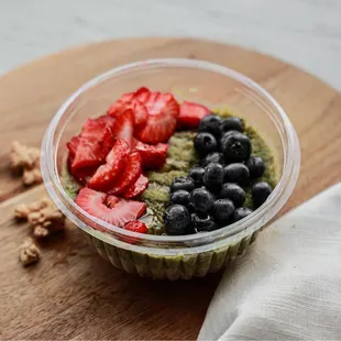a bowl of fruit and nuts
