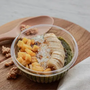 a bowl of fruit and nuts