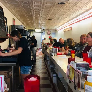 a line of diners waiting for customers