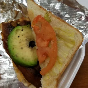 The oddball roundish piece of avocado I got that was supposed to be for my whole sandwich, and yes, that lettuce is brown and yellow.