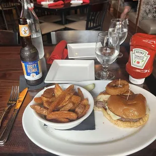 The "Turkey Burger" from the menu that I opted for beef instead. Really good but with really average potato wedges and onion rings.