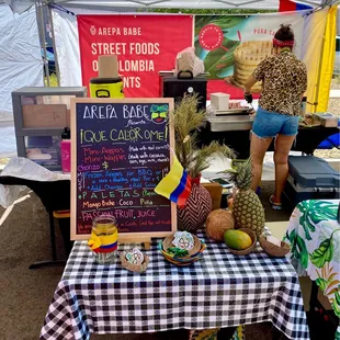 a table with a sign that says arta bara