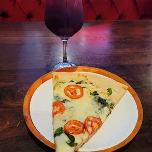 a slice of pizza and a drink
