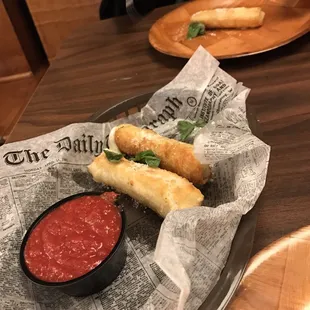 Wonton-wrapped mozzarella sticks are what's for awesome. These ones have a light, flakey coating with good sauce on the side.