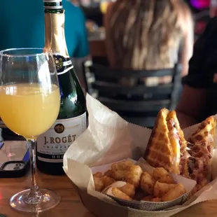 Breakfast sandwich with mimosa