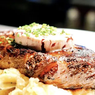 a plate of food with meat and mashed potatoes