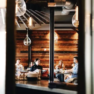 a group of people sitting at a table