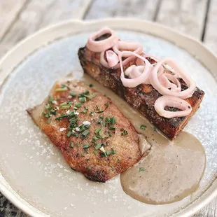 a plate of food on a wooden table