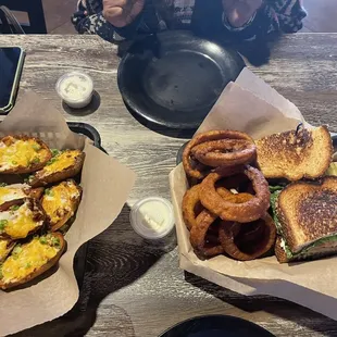 Turkey avocado sandwich with onion rings and potato skins. Excellent!