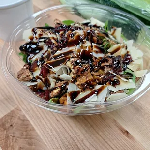 a salad in a plastic bowl