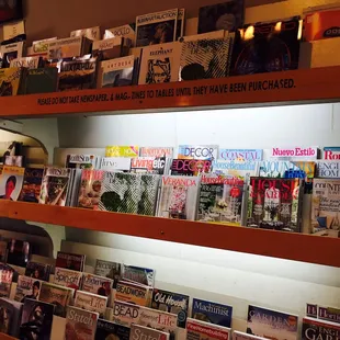 a shelf of magazines and magazines