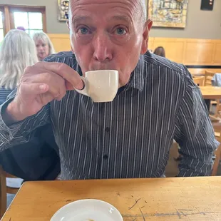 My husband with his espresso and extra.....nope just EXTRA!