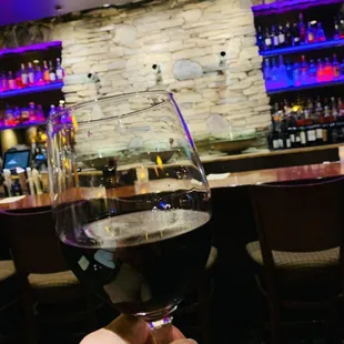 a person holding a glass of wine