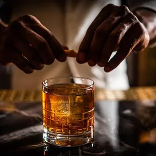 a man preparing a drink in a bar